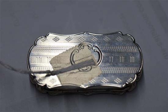 A Victorian silver shaped oval vinaigrette by Nathaniel Mills, the lid engraved with landscape scene,